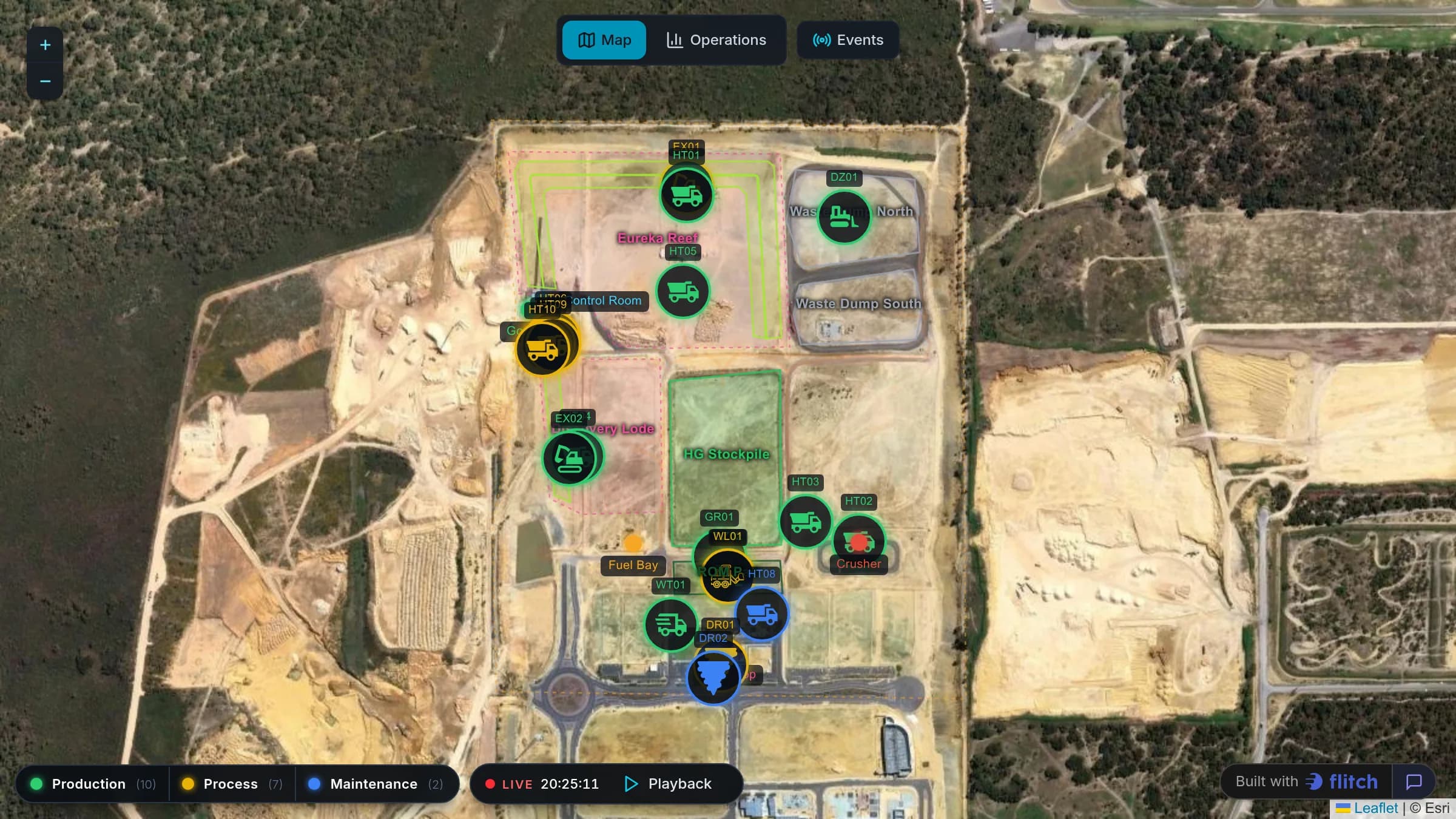 Satellite map of an open-pit mine with haul trucks, excavators and drills marked and colored by status, above a playback bar and a status legend