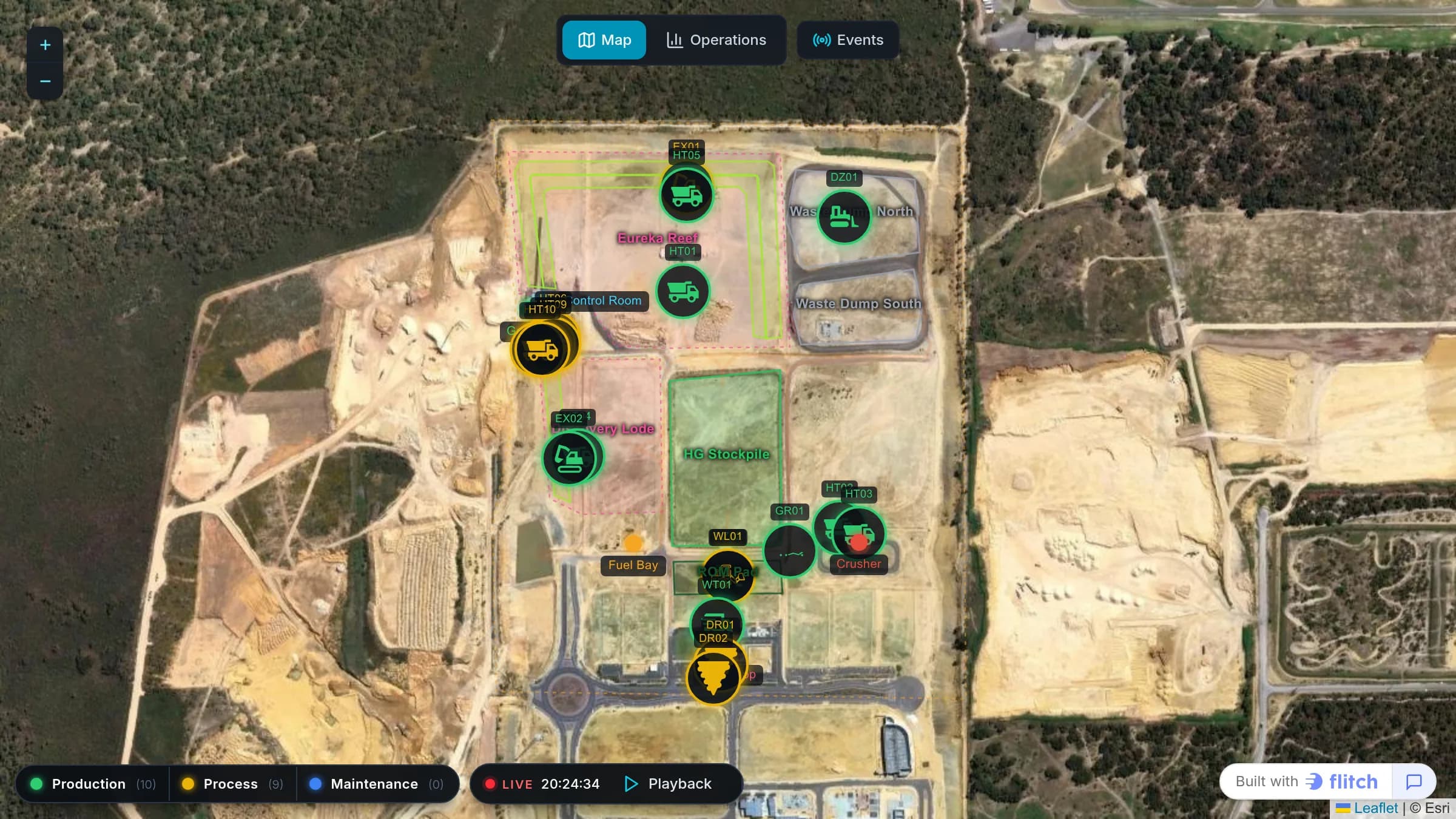 Satellite map of an open-pit mine with haul trucks, excavators and drills marked and colored by status, above a playback bar and a status legend